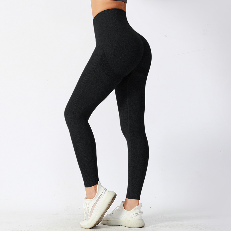 Pantalones de yoga ajustados de cintura media con tela de alto rendimiento que absorbe la humedad