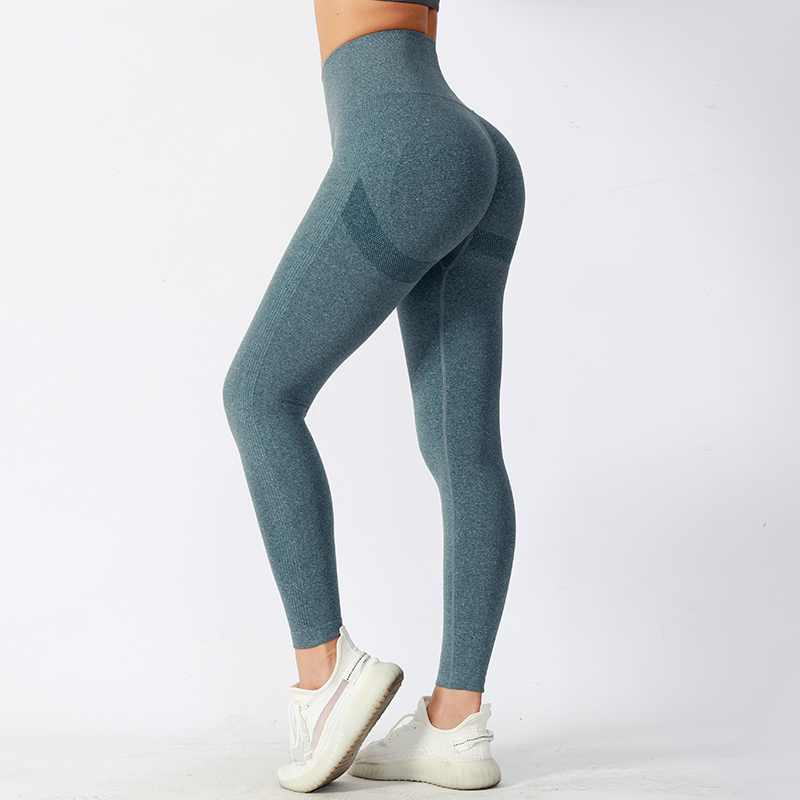 Pantalones de yoga ajustados de cintura media con tela de alto rendimiento que absorbe la humedad