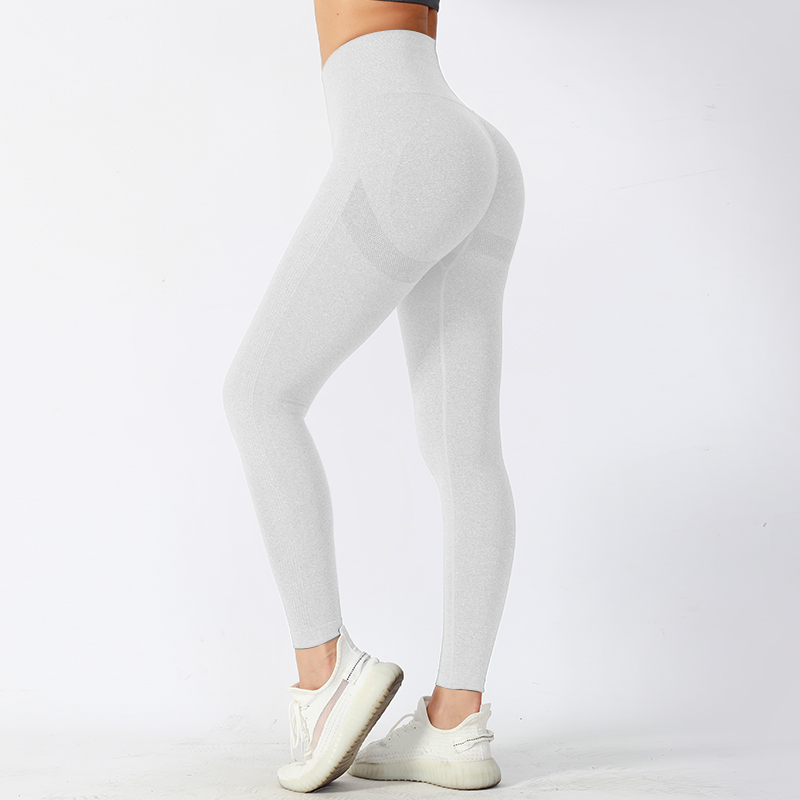 Pantalones de yoga ajustados de cintura media con tela de alto rendimiento que absorbe la humedad