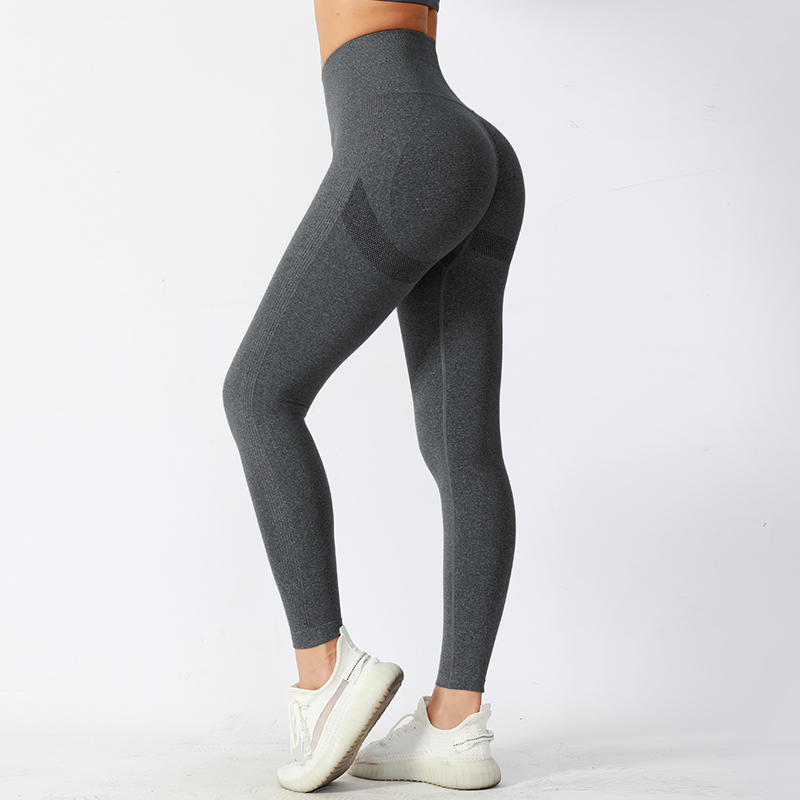 Pantalones de yoga ajustados de cintura media con tela de alto rendimiento que absorbe la humedad