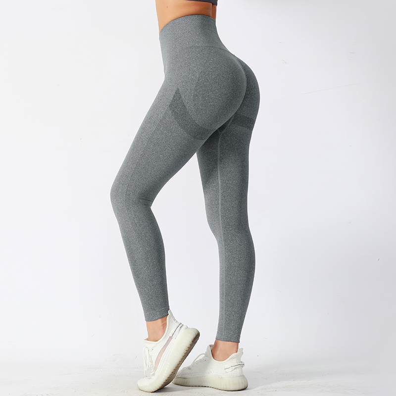 Pantalones de yoga ajustados de cintura media con tela de alto rendimiento que absorbe la humedad