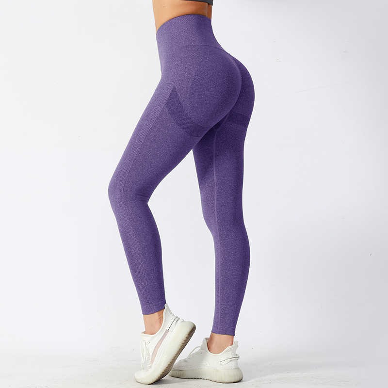 Pantalones de yoga ajustados de cintura media con tela de alto rendimiento que absorbe la humedad
